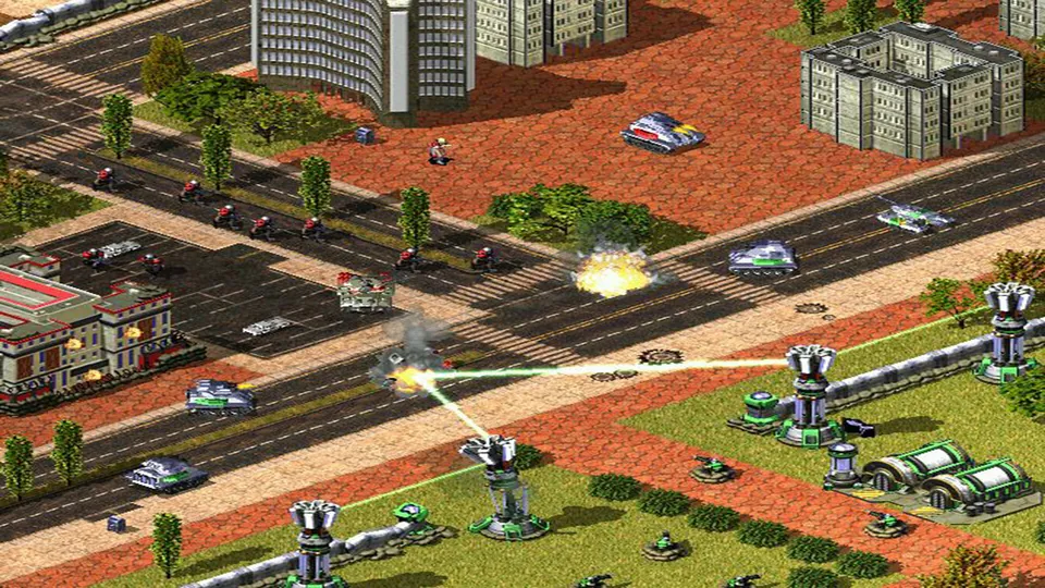 Red Alert 2 tanks and infantry move through an isometric city street. Original-game reference.